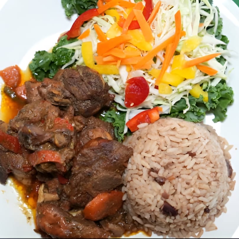 Jamrock Grill's Caribbean oxtail stew with rice and peas, and a fresh vegetable salad.
